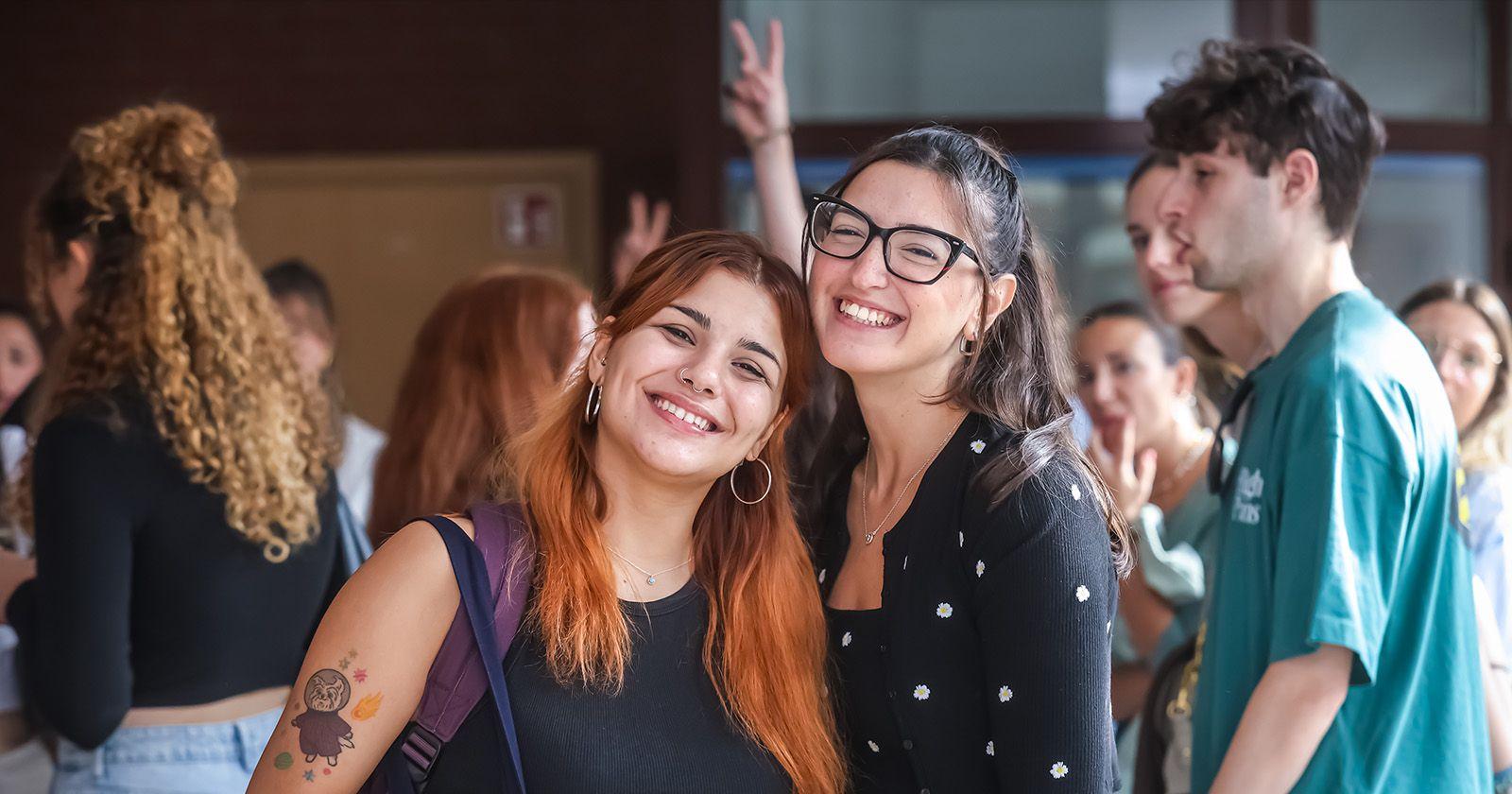 Students laughing and talking at a social event during university orientation week